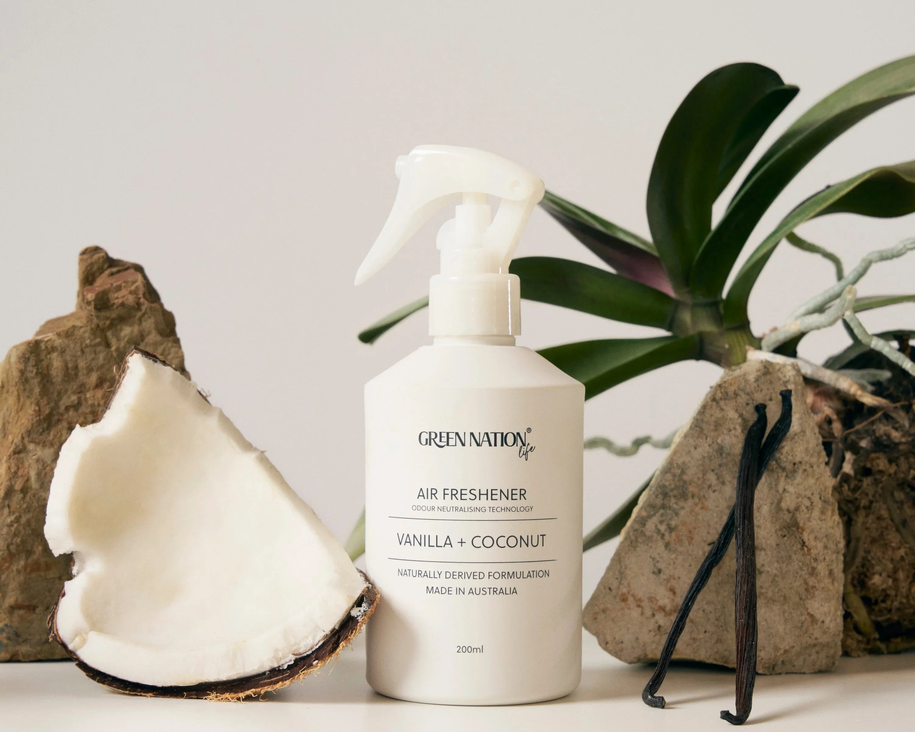 Green Nation Life vanilla coconut air freshener bottle with coconut, vanilla pods, and orchid