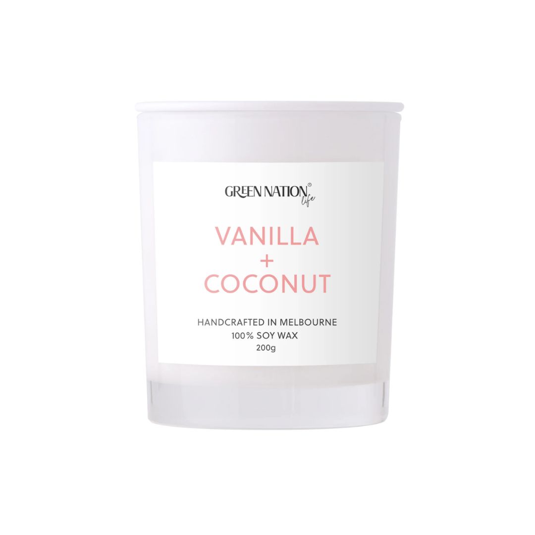 Vanilla coconut soy wax candle in clear glass, Green Nation Life label, minimalist style.