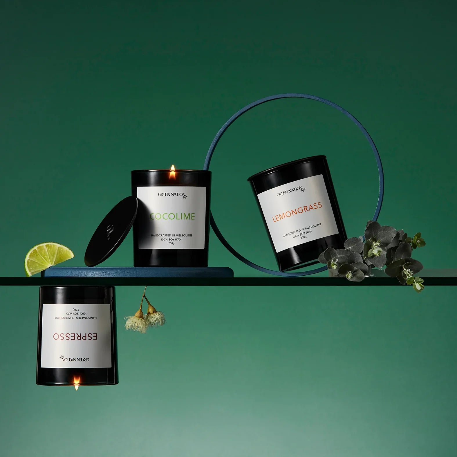Three scented soy candles labeled Cocolime, Lemongrass, and Espresso with lime and flowers.